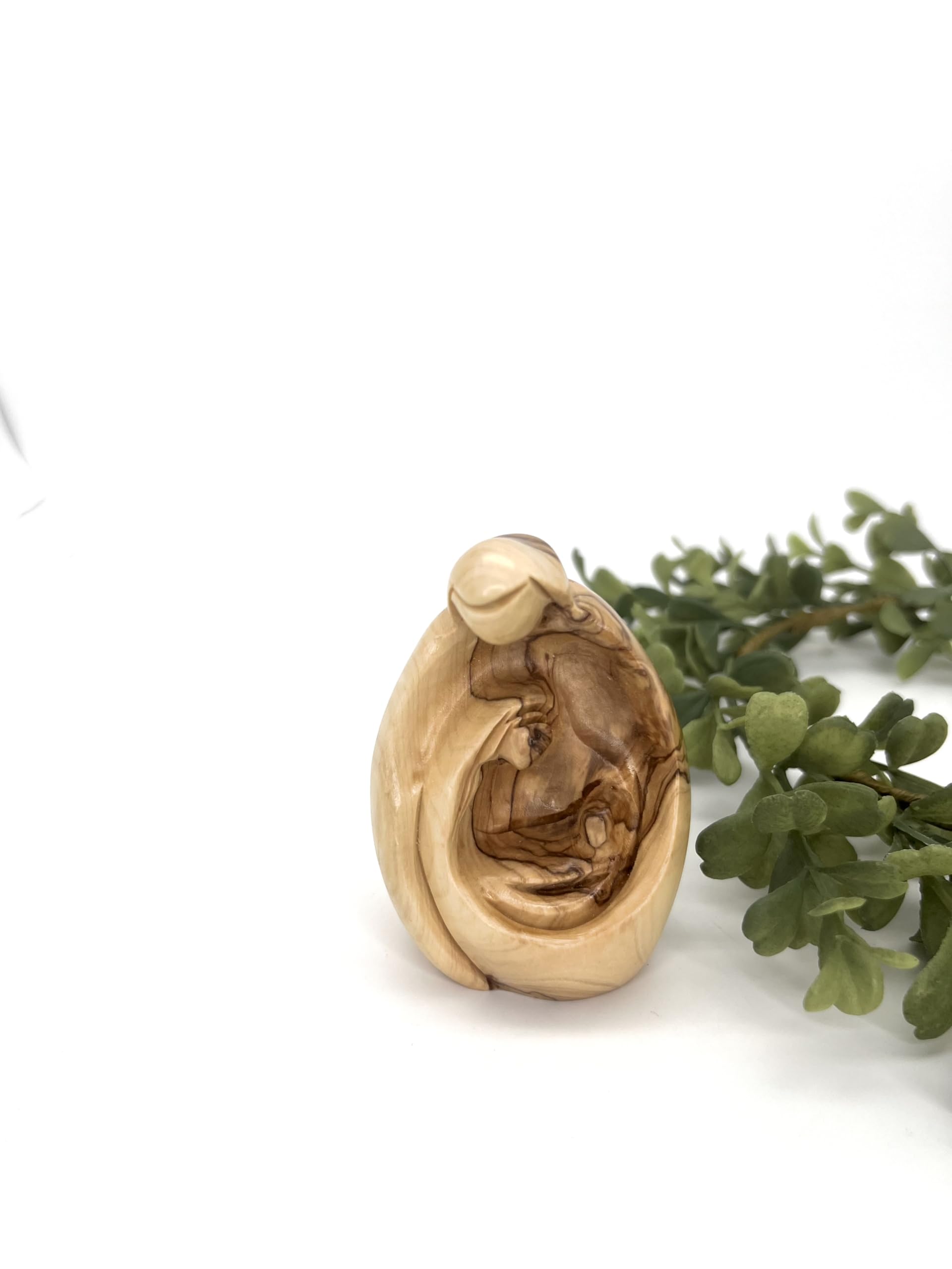 Holy family statue display on tiered tray