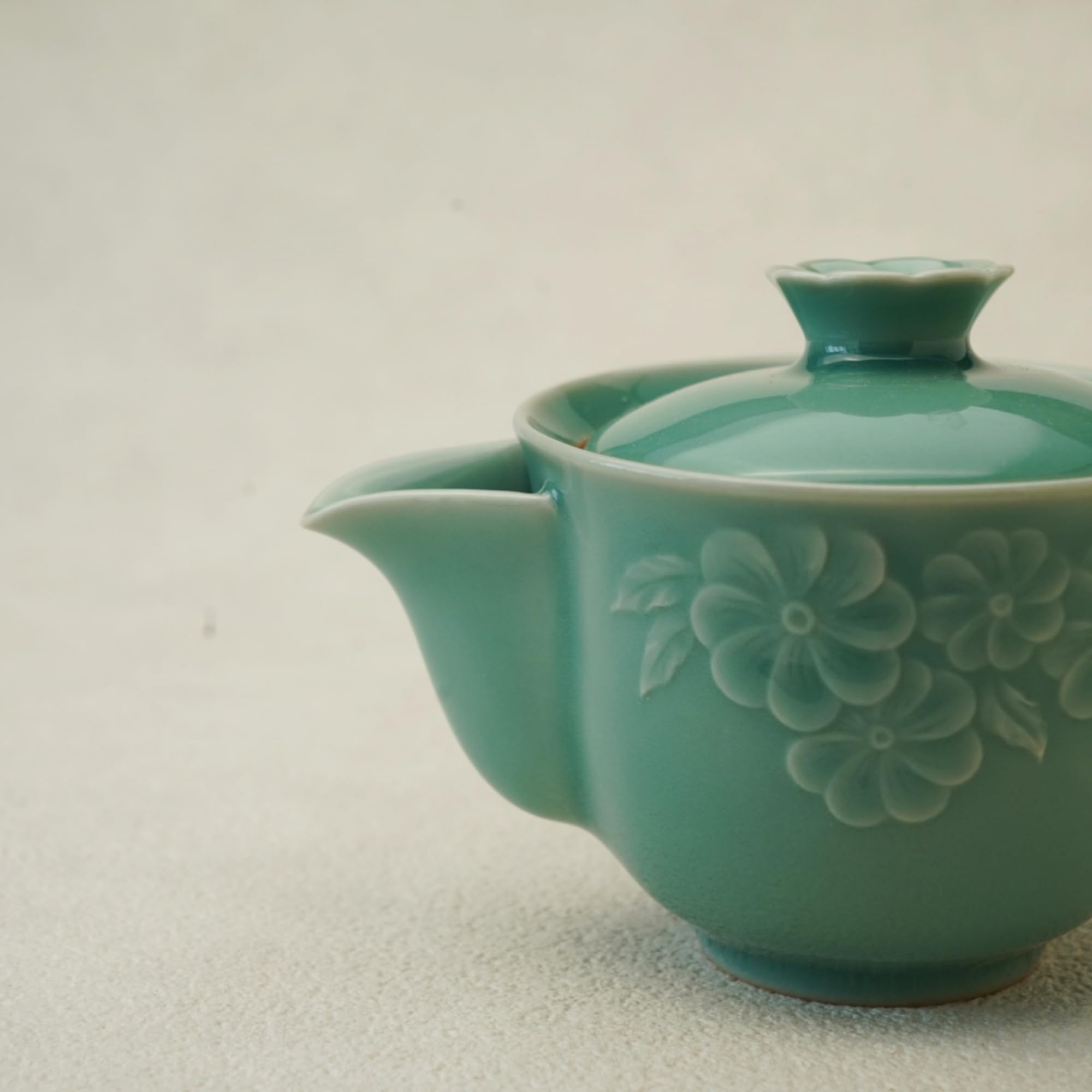 Longquan Celadon teapot with floral carvings