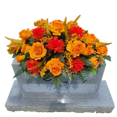 Cemetery Saddle with orange roses and mums on metal frame for headstone decor