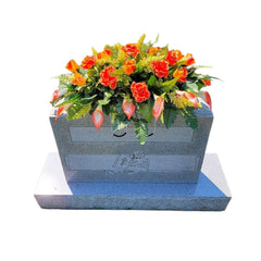 Cemetery Saddle Memorial Decoration with orange roses and calla lilies