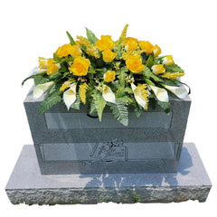 Cemetery saddle on headstone with four-leg metal frame