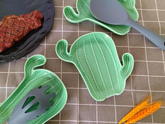 Ceramic spoon rest for kitchen counter featuring green cactus motif