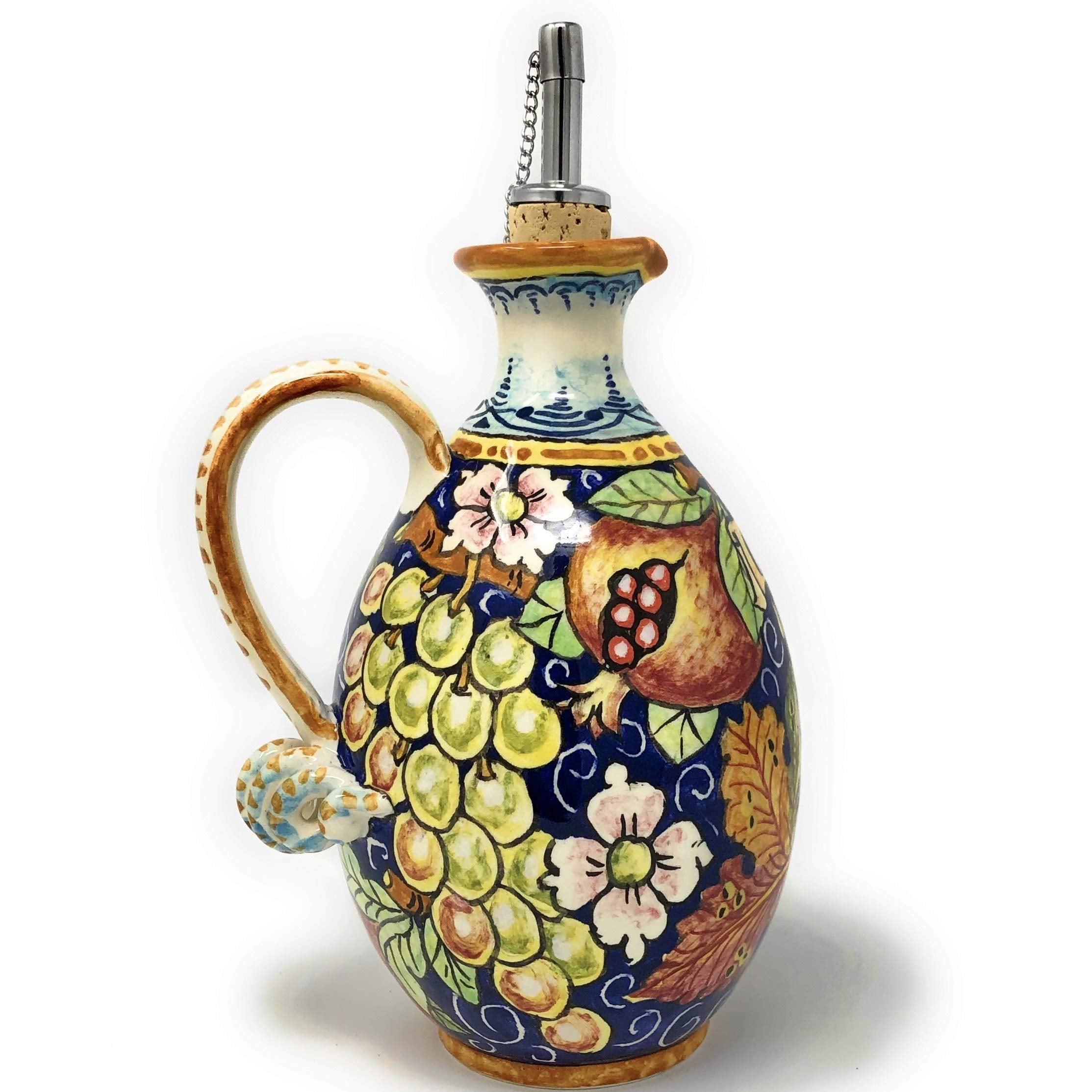 Blue ceramic oil cruet featuring grapes and pomegranate