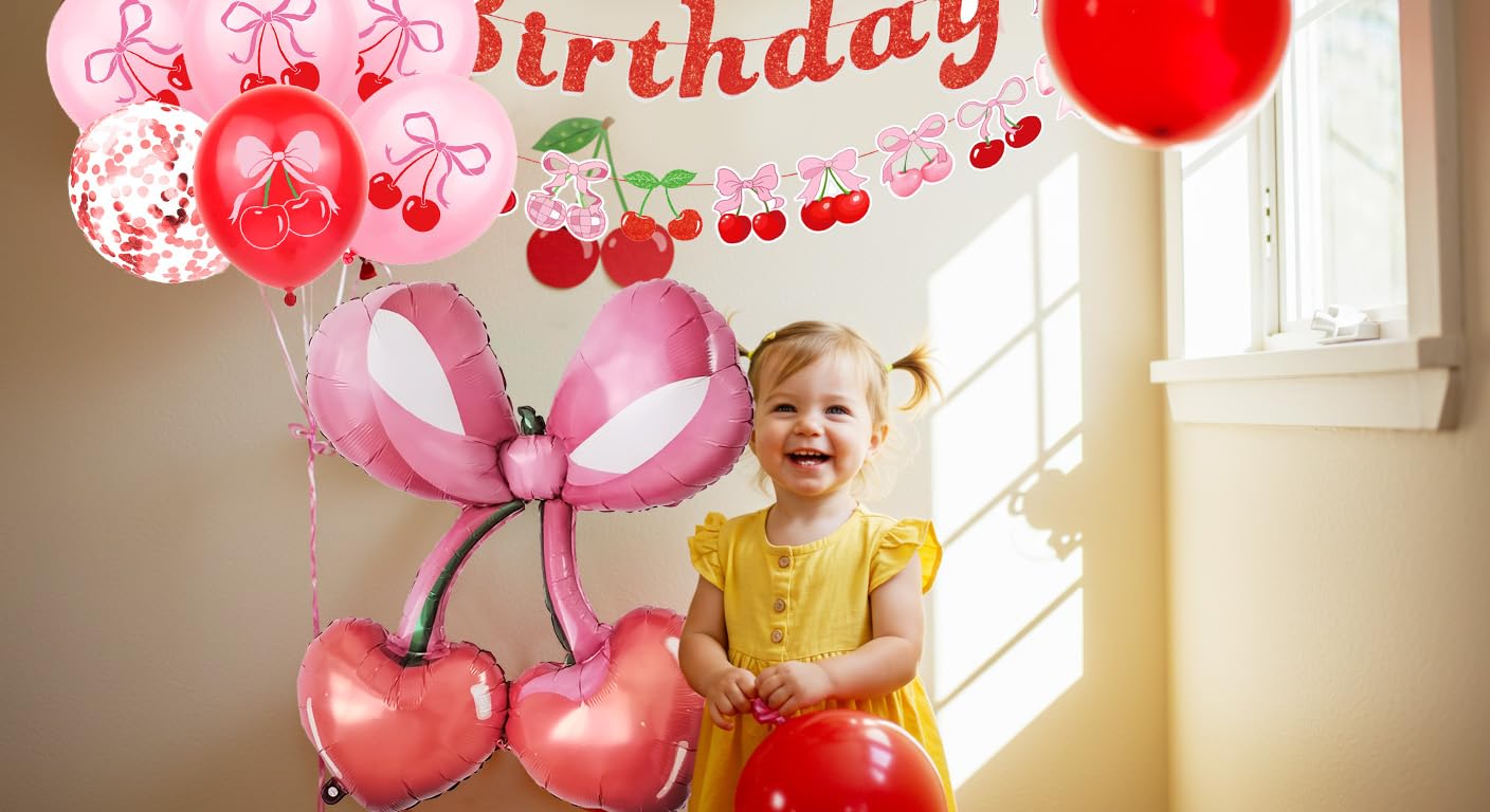 Girls birthday decor with cherry bows and pink accents