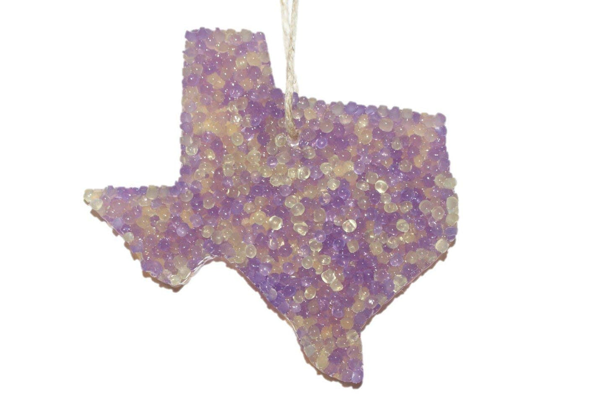 ChicWick Lemon Lavender Texas Shape Car Freshener hanging from car rearview mirror