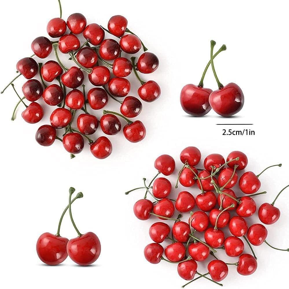 Christmas ornament display with fake red cherries