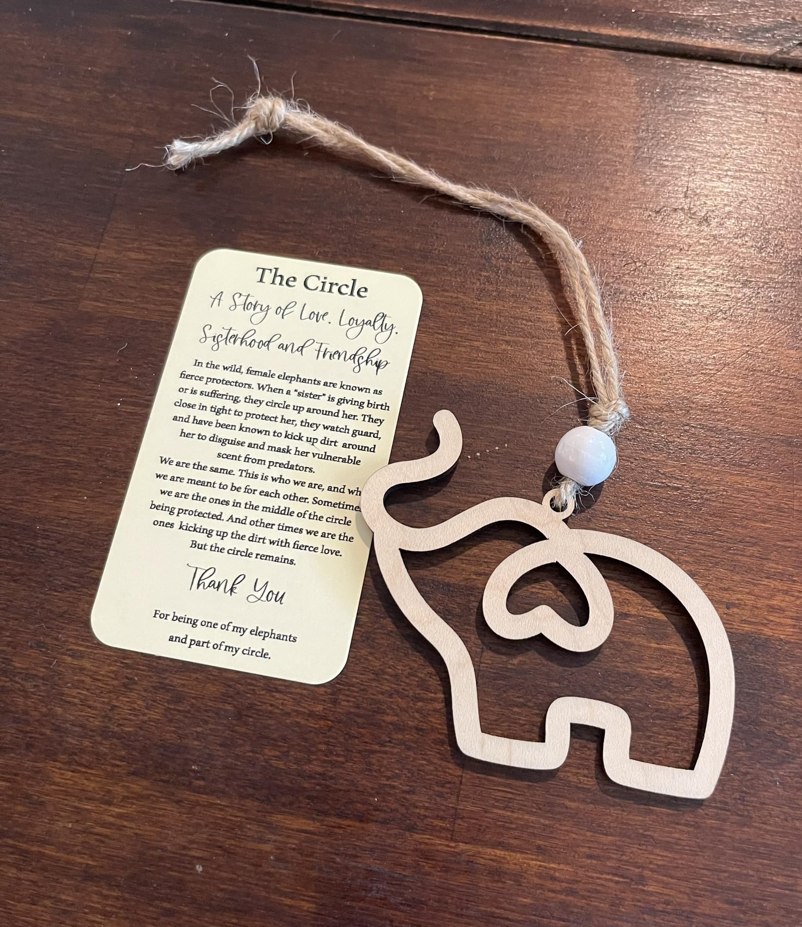 Maple wood ornament with white bead