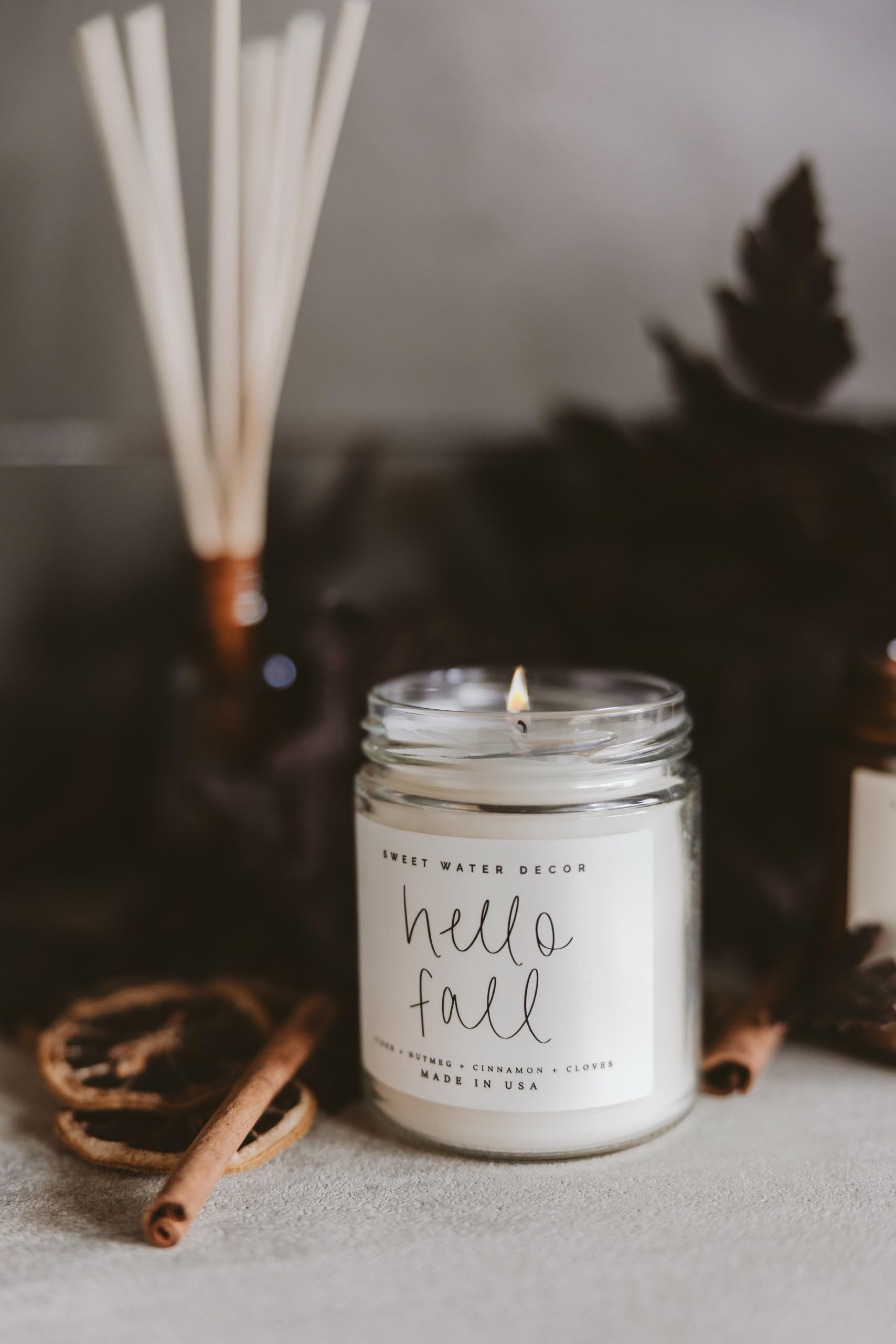 Autumn scented candle in clear glass jar