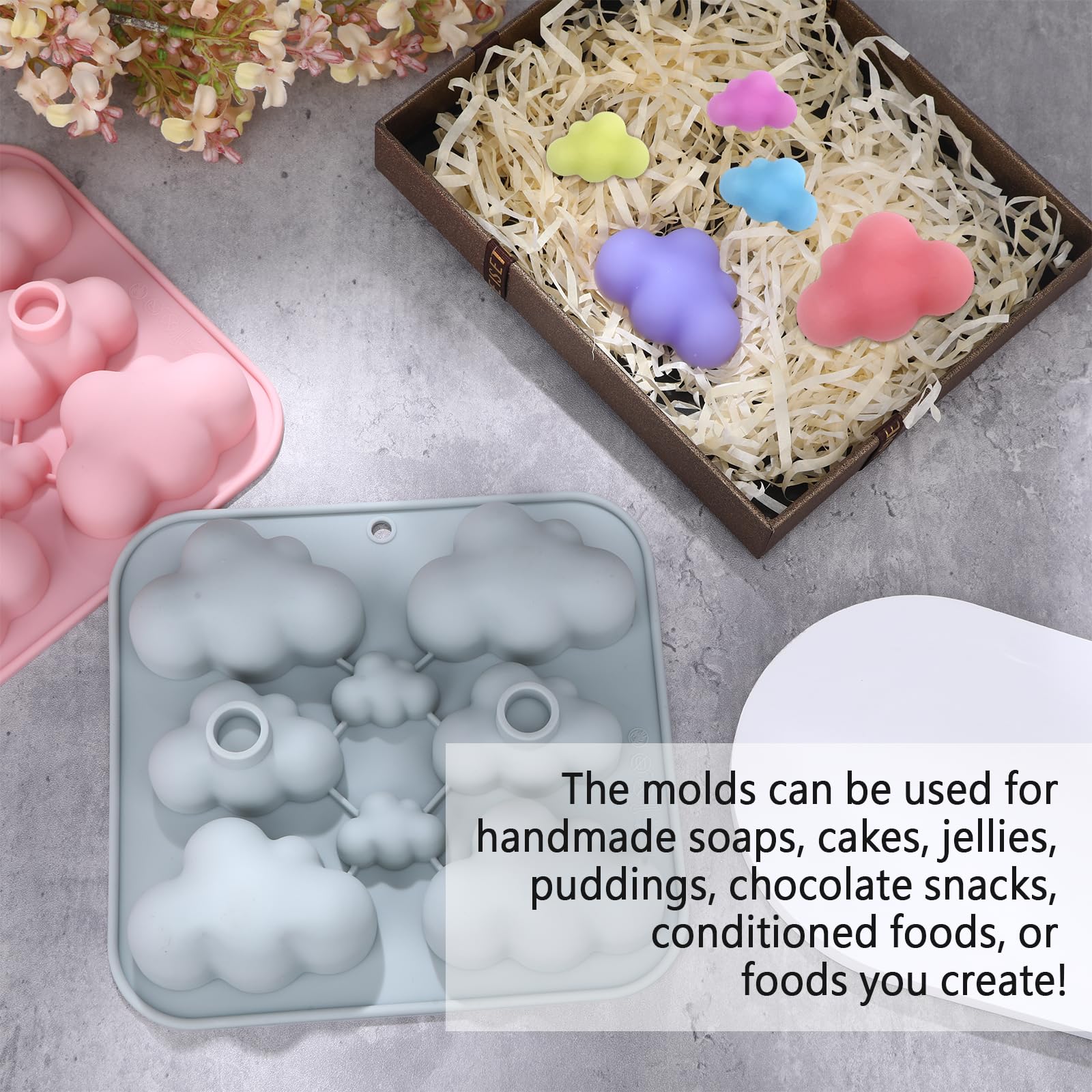 Two cloud shaped silicone molds with mixing stick gray pink