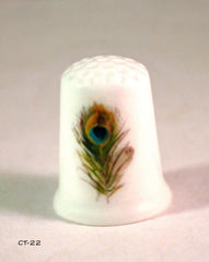 Handmade thimble featuring a peacock feather design