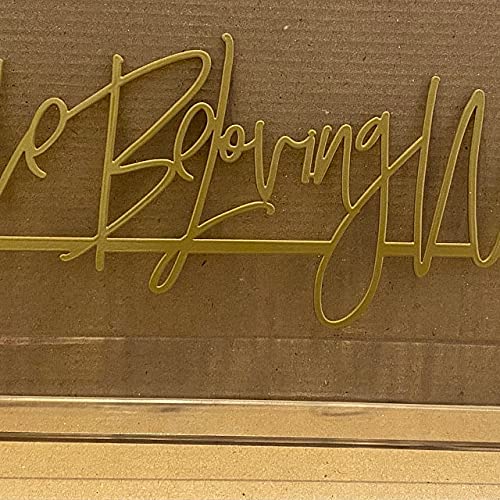 Silver color metal hashtag sign on table