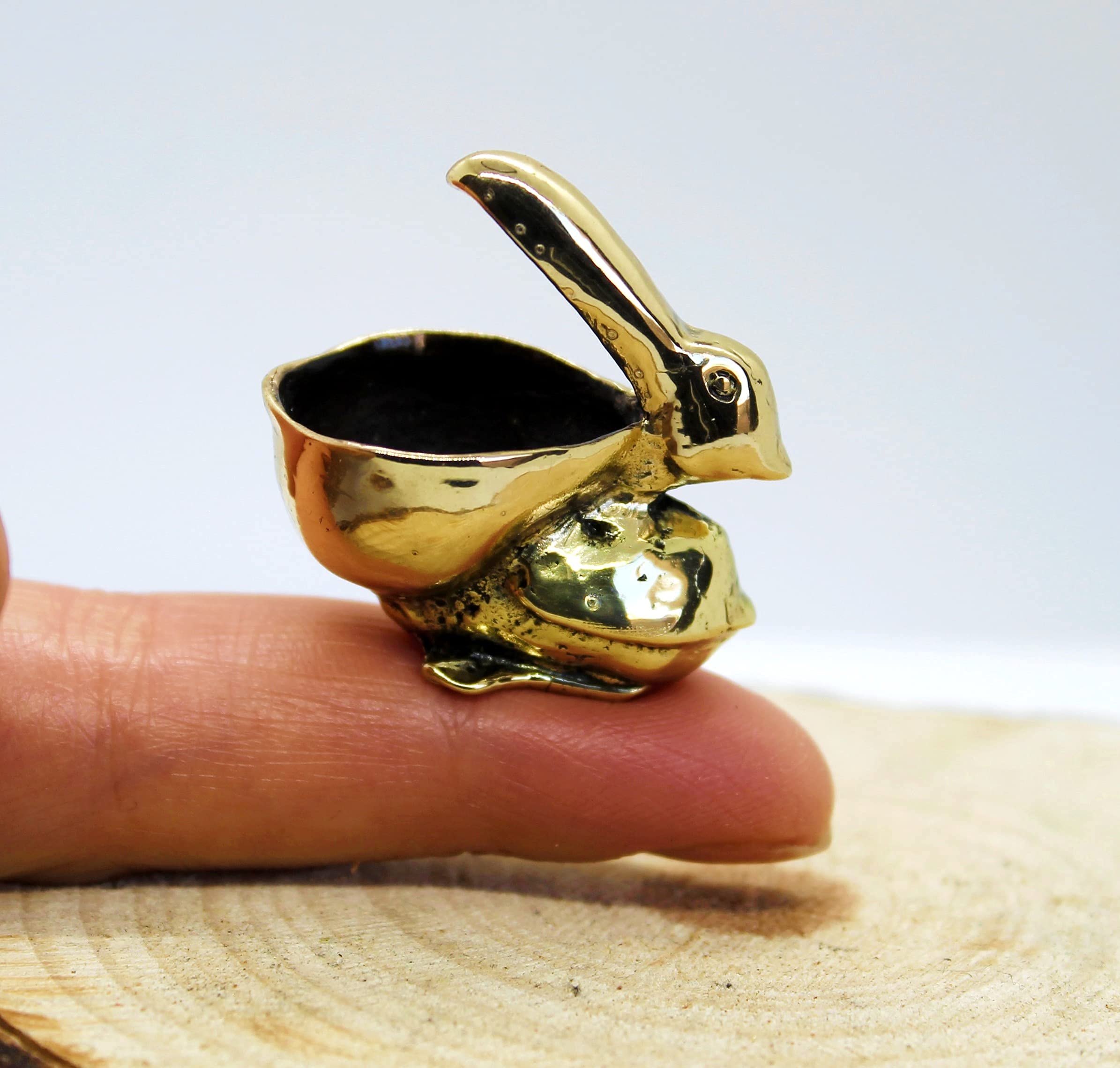 Compact brass bird statuette for mantel