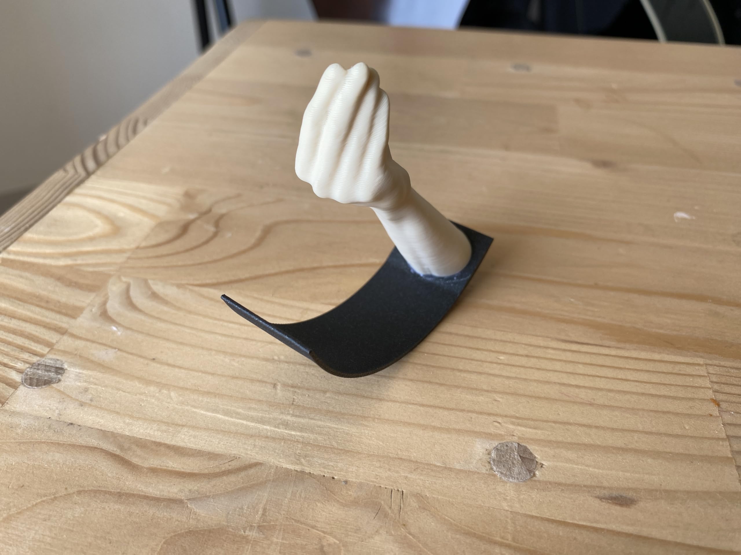 Gift idea Italian Hand Gesture Desk Toy shown in an office decor setup