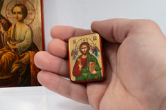 Portable handmade icon designed to fit wallet or bag