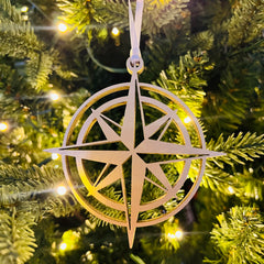 Golden compass ornament with satin ribbon