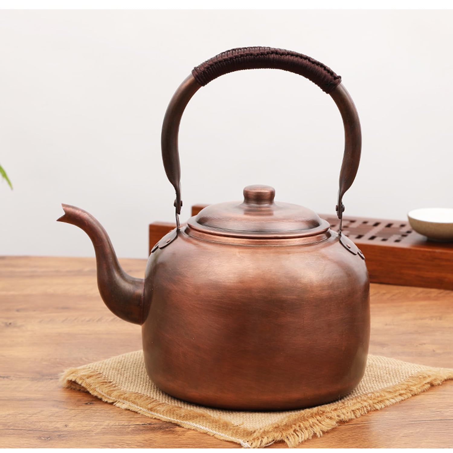 Copper teapot with polished interior and exterior