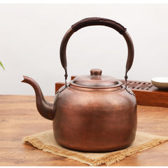 Copper teapot with polished interior and exterior