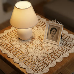 cotton crochet lace tablecloth close up showing knitted floral pattern