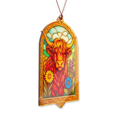 Colorful HighlandCow ornament capturing light for window display