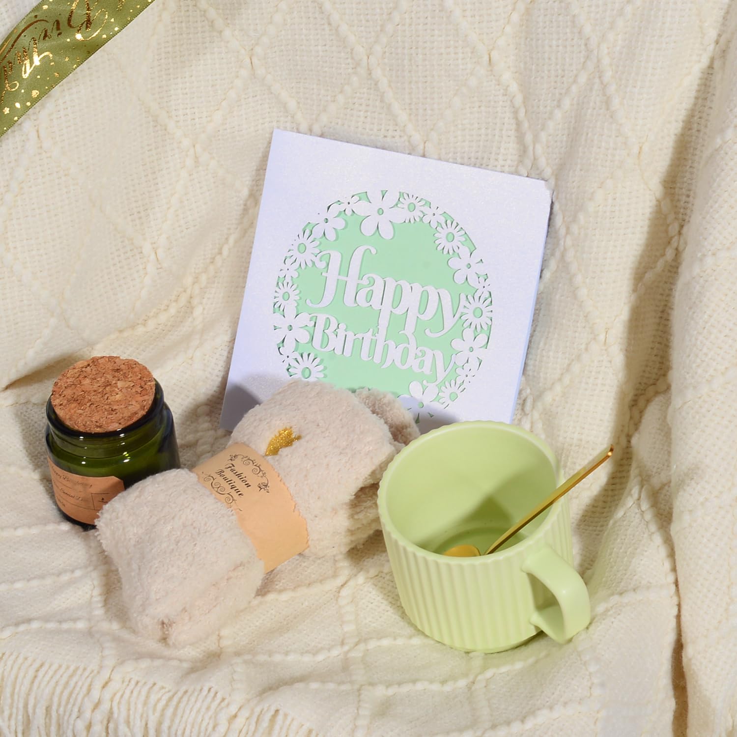Cozy blanket and fuzzy socks close up from birthday gift set