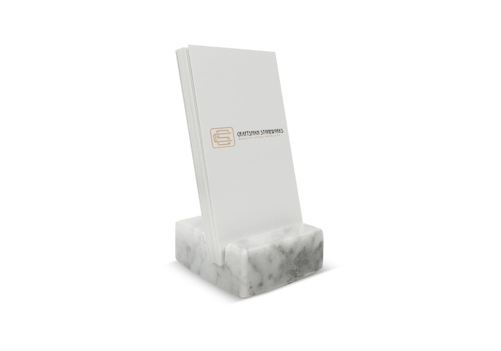 Close up of white Carrara marble card holder by Craftsman Stoneworks
