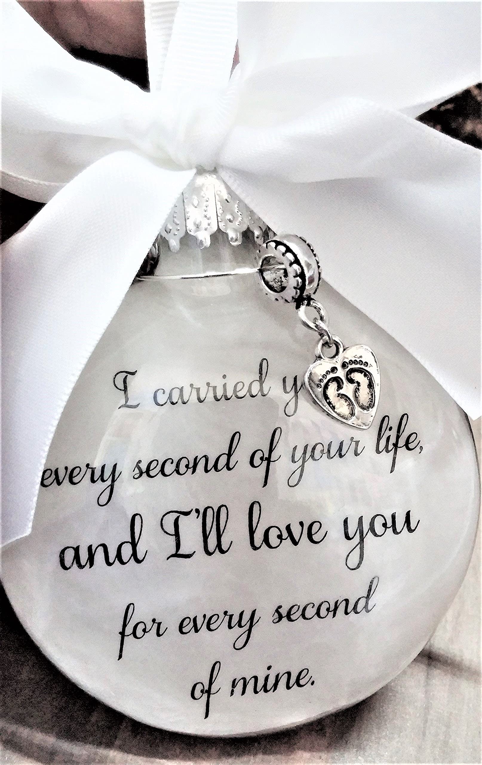 Hand-tied white satin bow atop the ornament