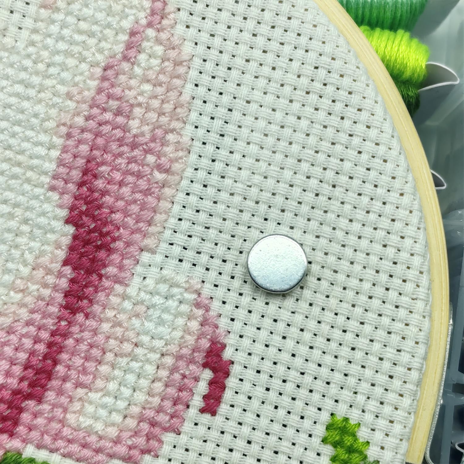 Cross stitch embroidery needle minder used in needlework projects