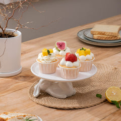 Bunny shaped cupcake stand displaying desserts