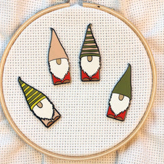 Custom drawn hard enamel gnome needle minder close up