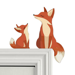 Two carved wooden fox door toppers mama and baby