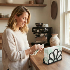 Weighted base napkin dispenser for table top use