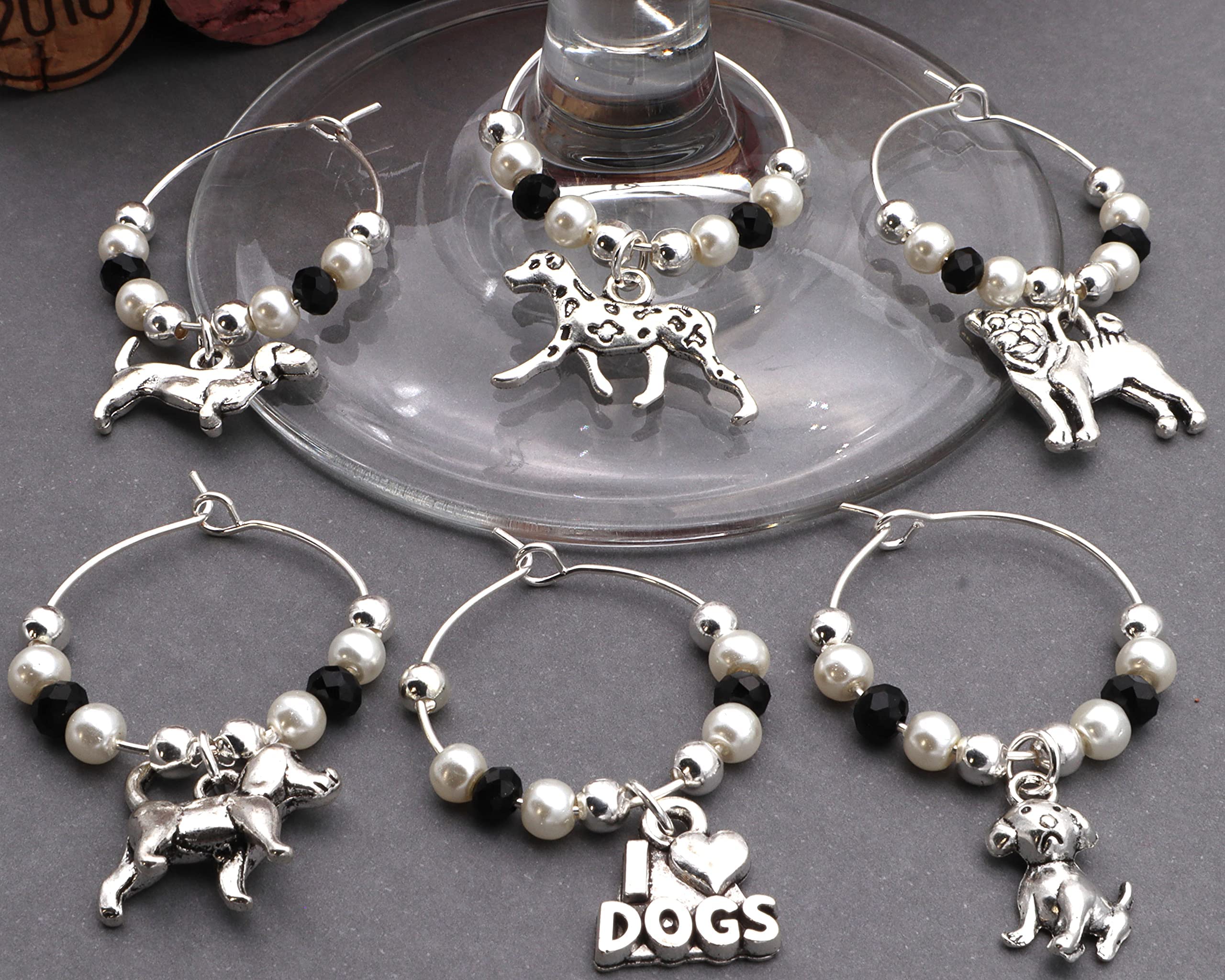 Six charms on silver hoops ready to clip onto wine stems