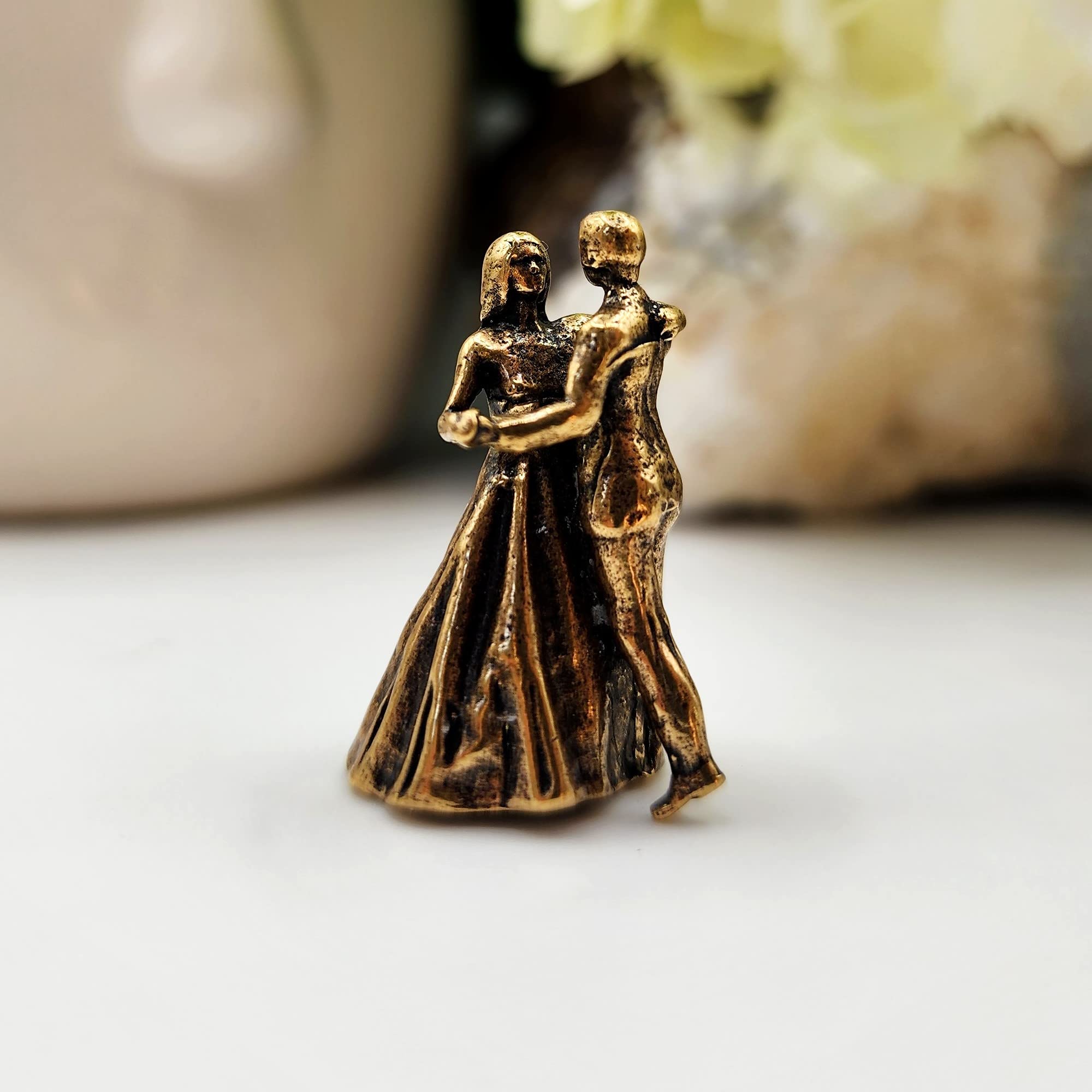Dancing couple sculpture with graceful pose in brass