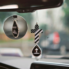 Cross with wings symbol on devotional car decor