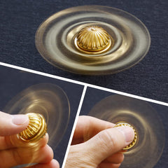 Decorative gold fidget spinner on desk
