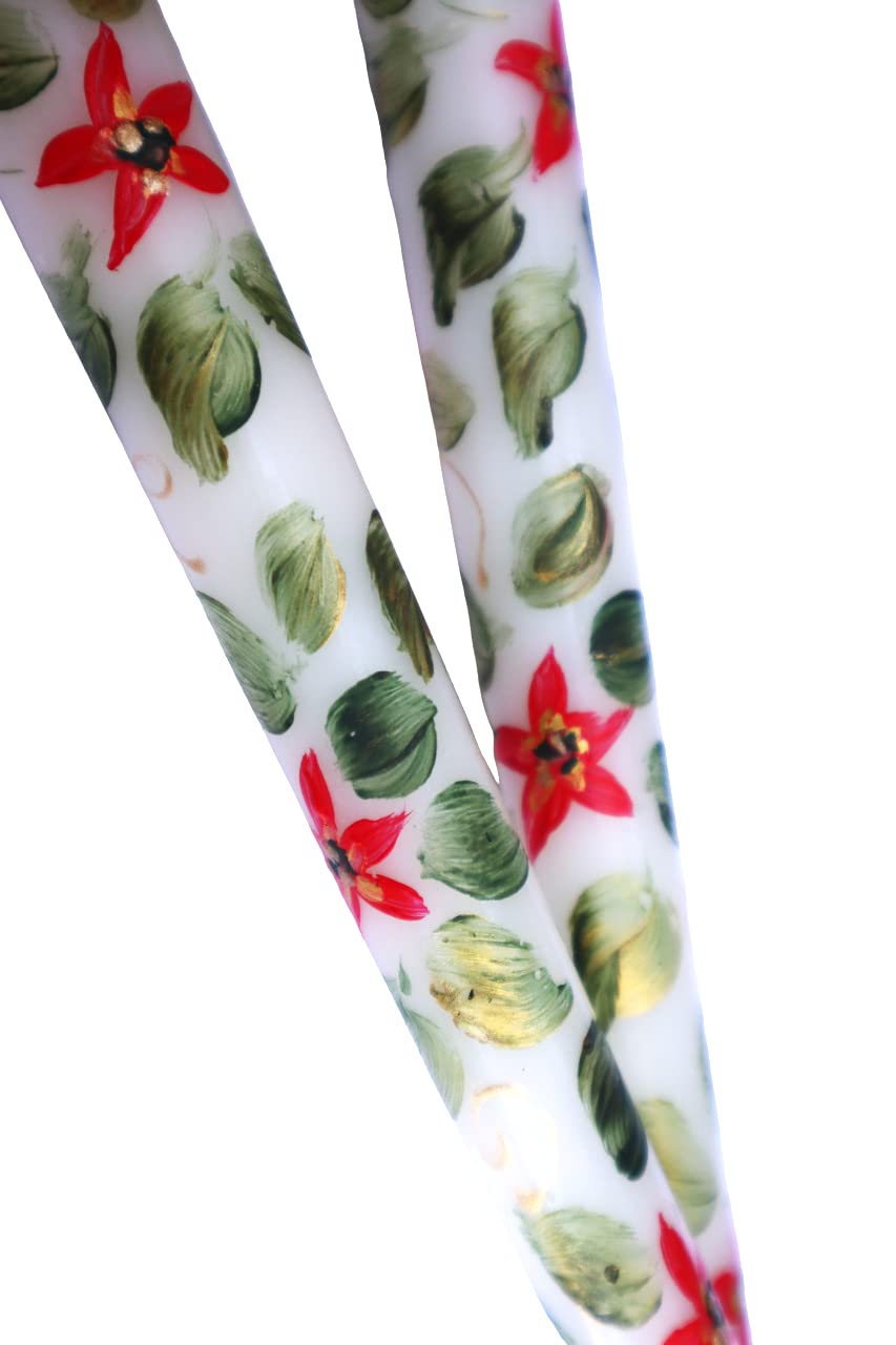 Elegant decorative poinsettia taper candles for Christmas table