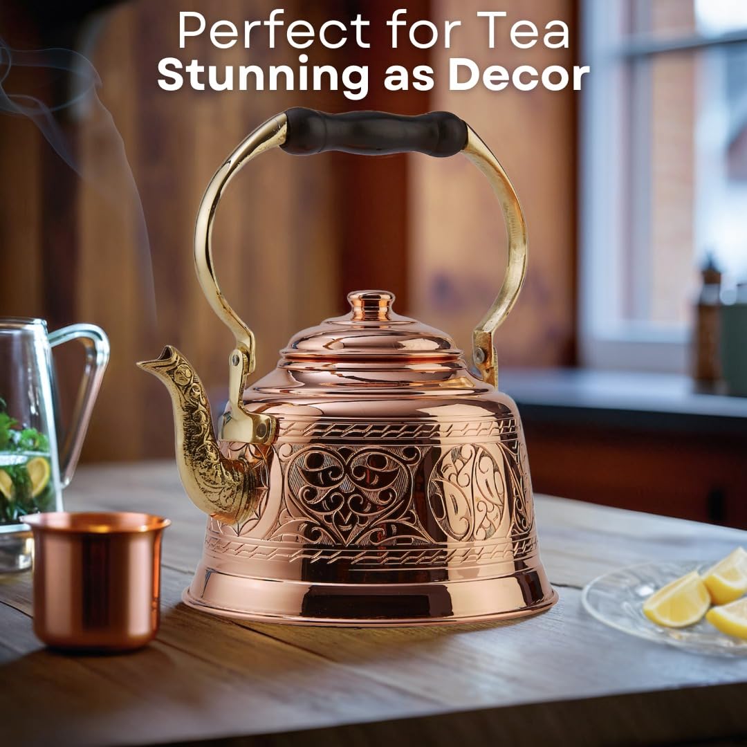 Stovetop compatible copper tea pot designed for easy pouring