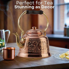 Stovetop compatible copper tea pot designed for easy pouring
