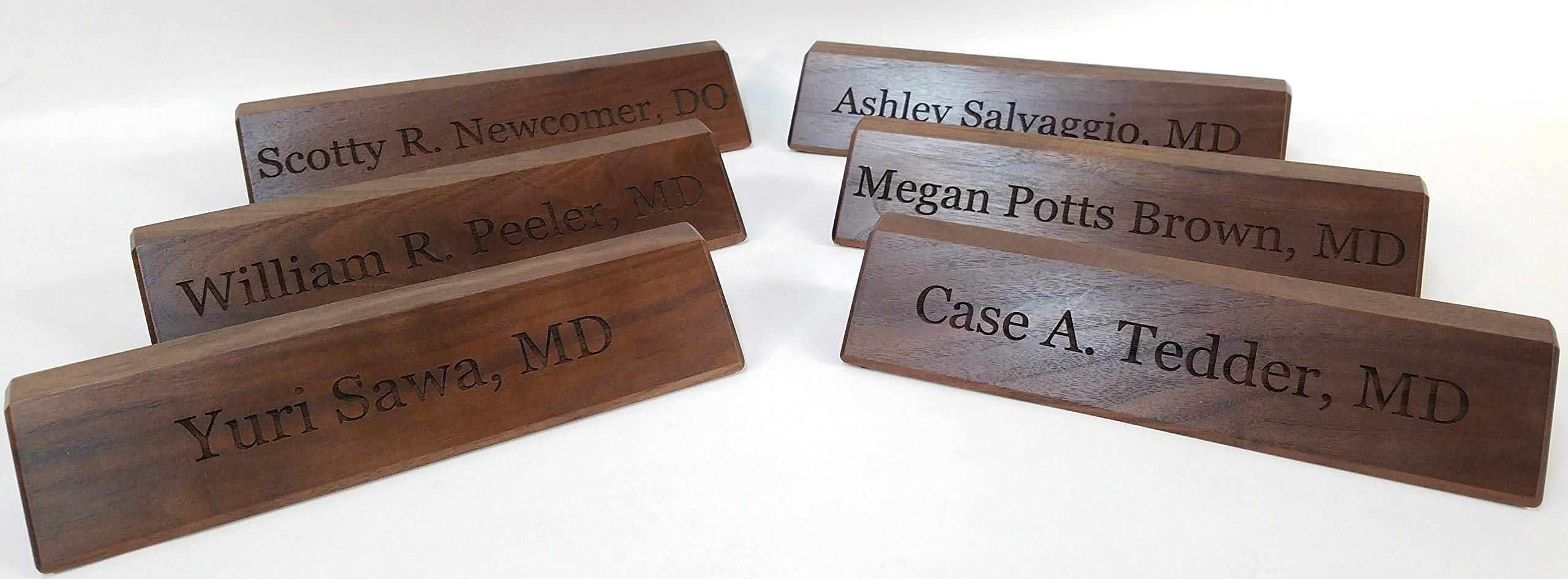 Walnut wood engraving contrasts on nameplate
