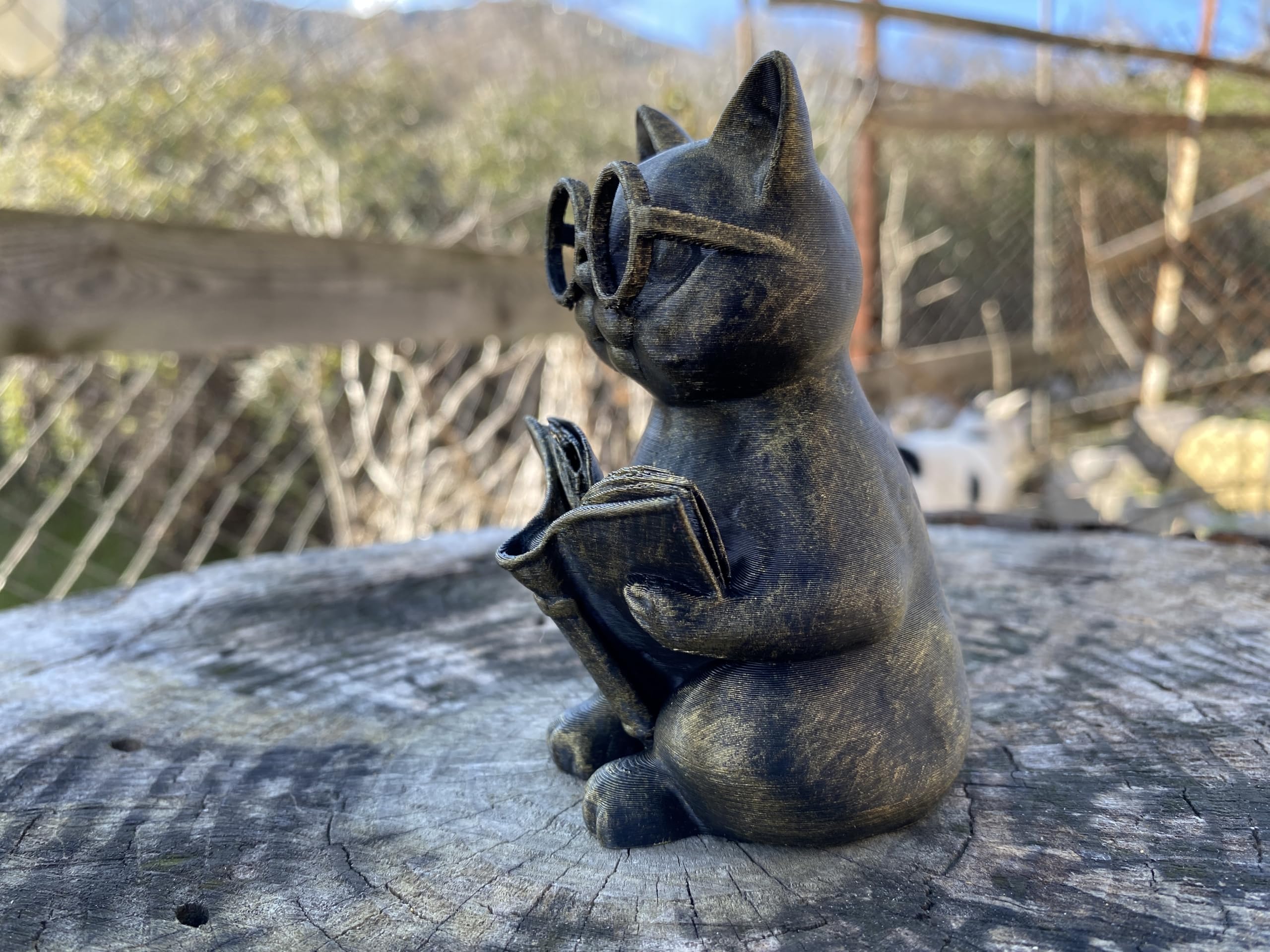 Lightweight durable cat reading figurine for display