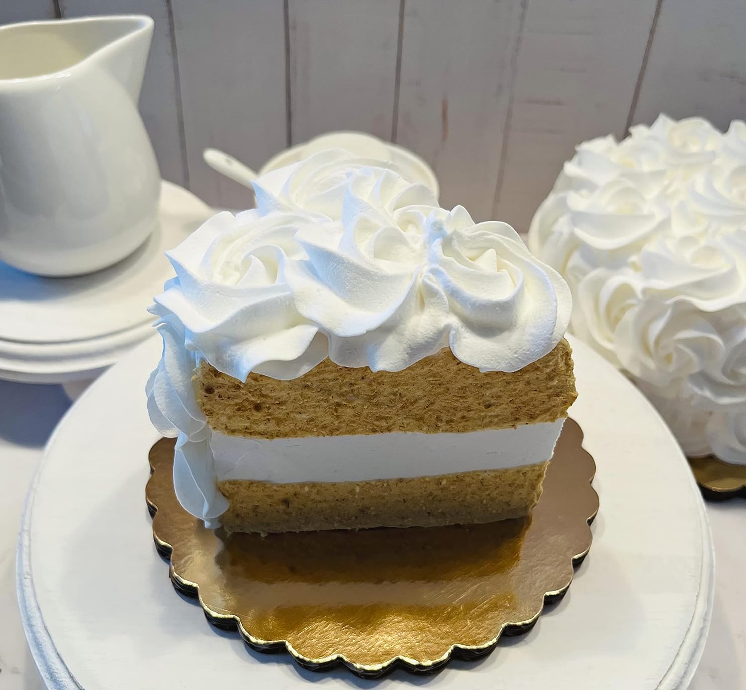3.5 inch wide by 4 inch tall white rosette cake slice on 6 inch board