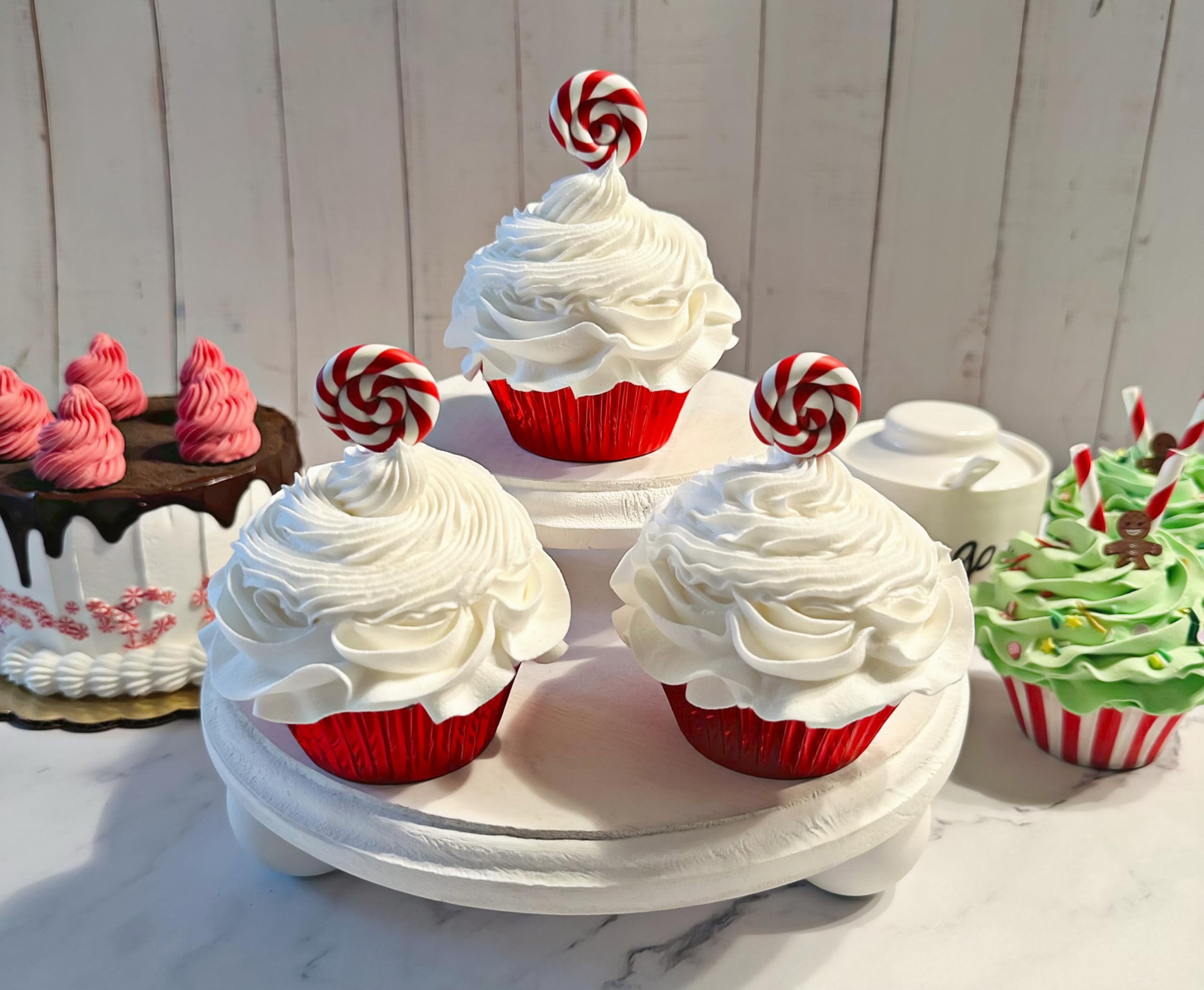 Decorative fake cupcakes on cake stand by Dezicakes