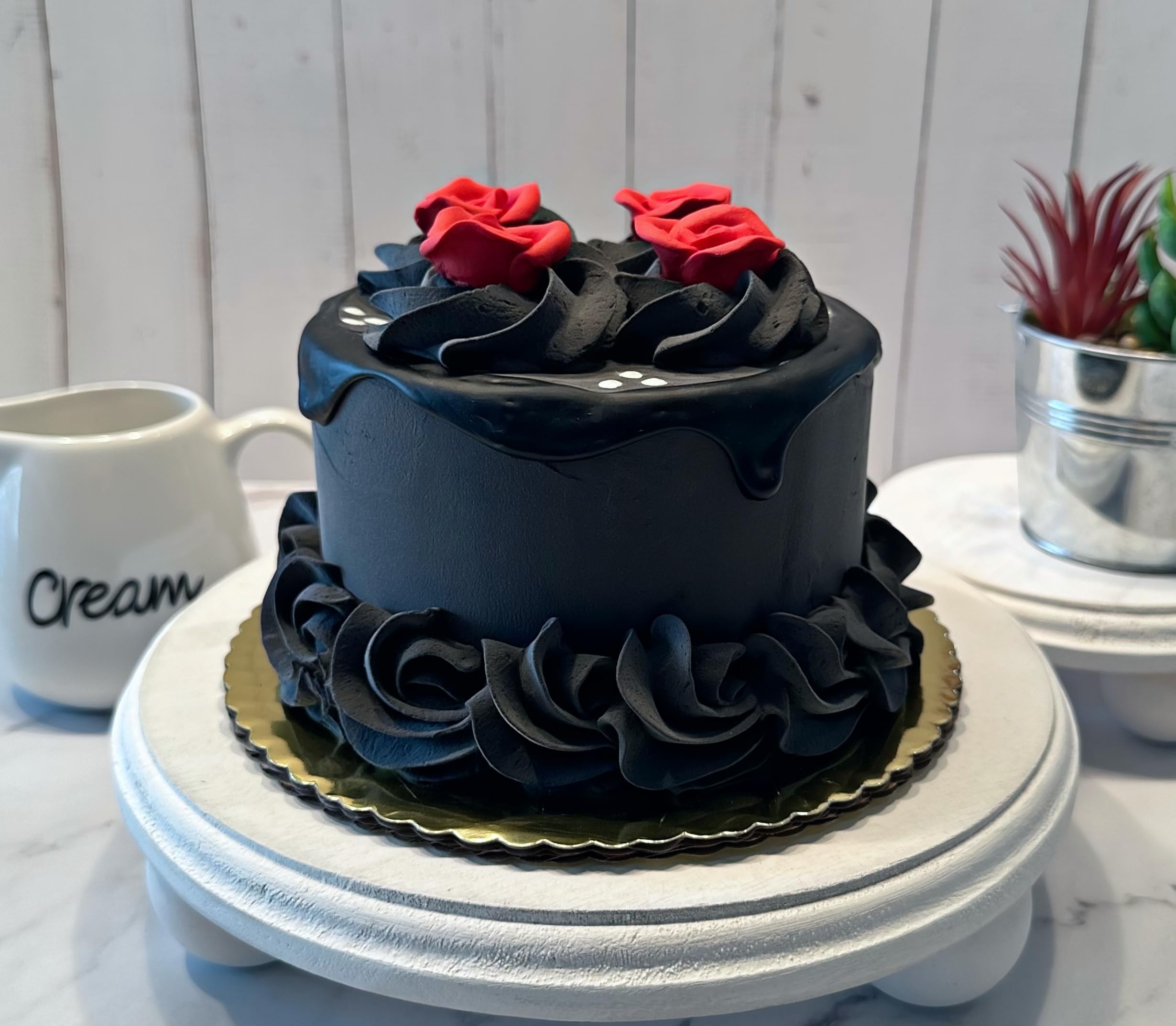 Fake cake black red drizzle close up by Dezicakes