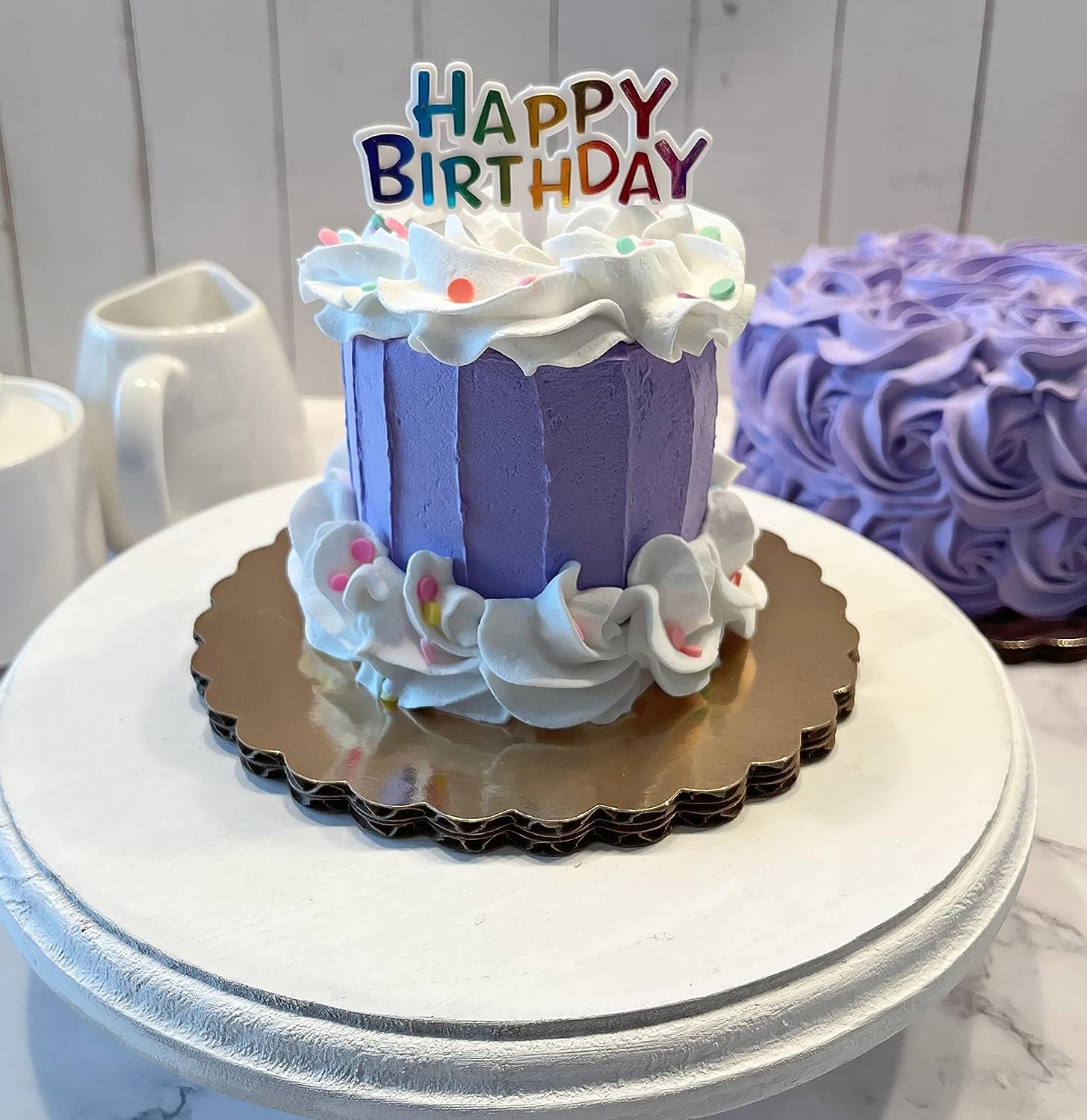 Purple mini fake cake on cake stand display