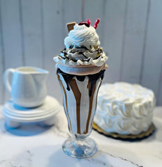 Fake milkshake in plastic parfait glass display prop