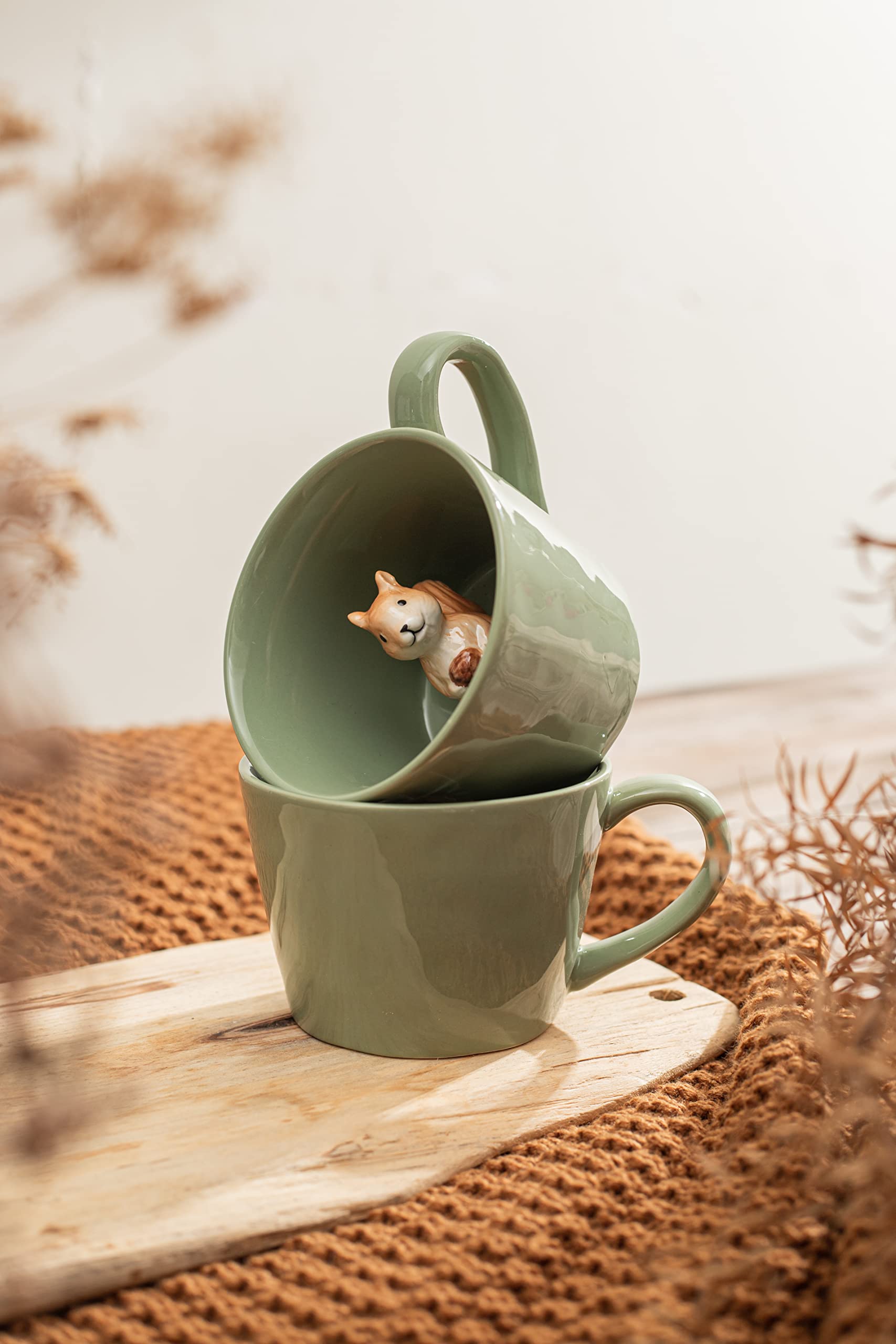 Bottom reveal feature with a hidden squirrel in the mug
