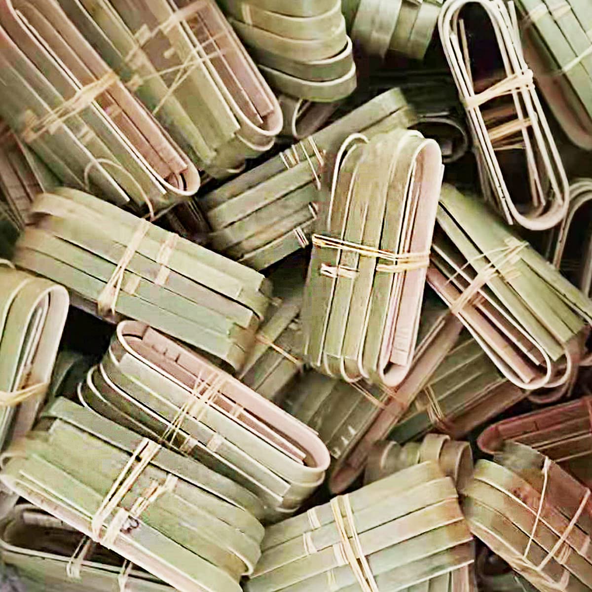 Green bamboo tongs for cooking and serving