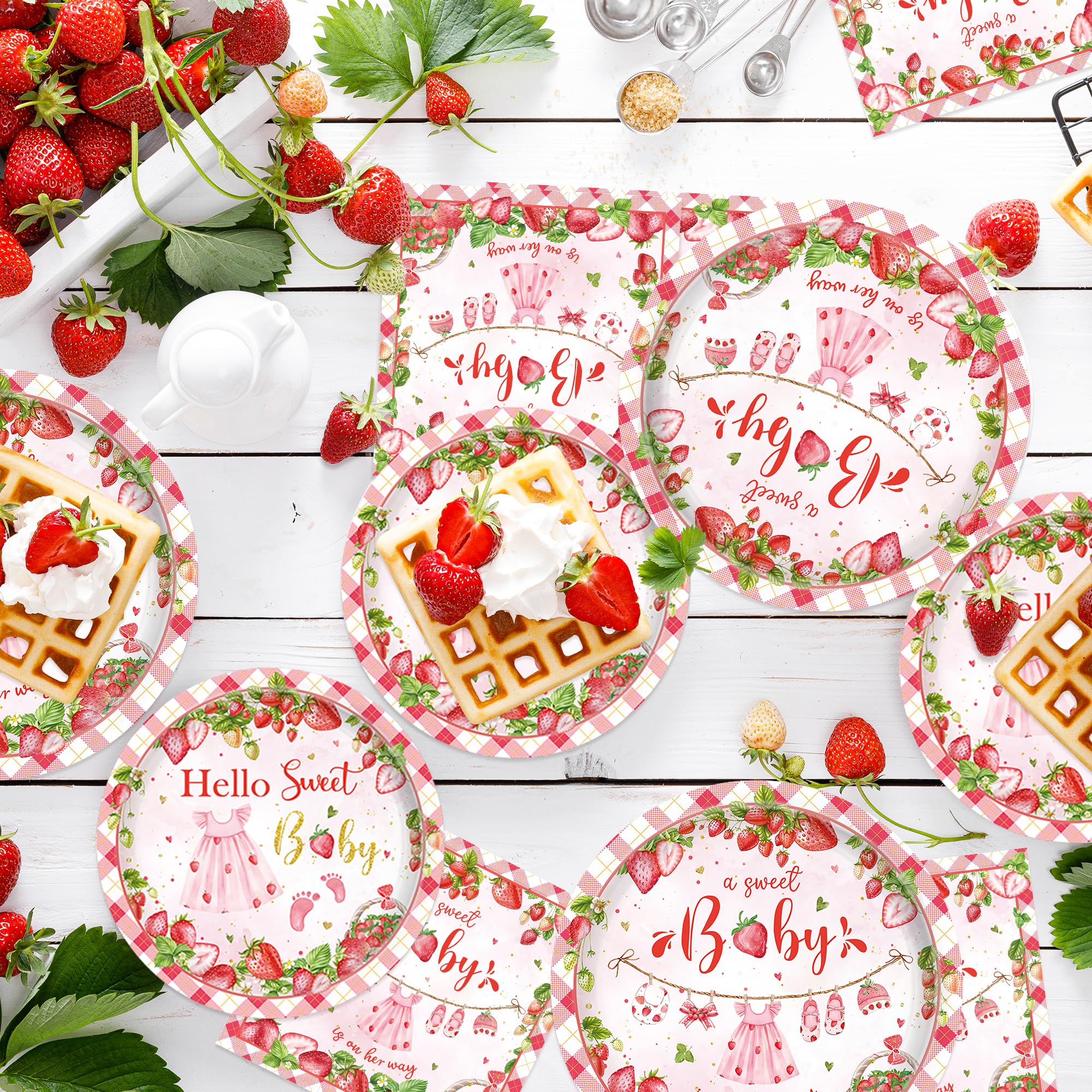 Bright strawberry themed party supplies for celebration