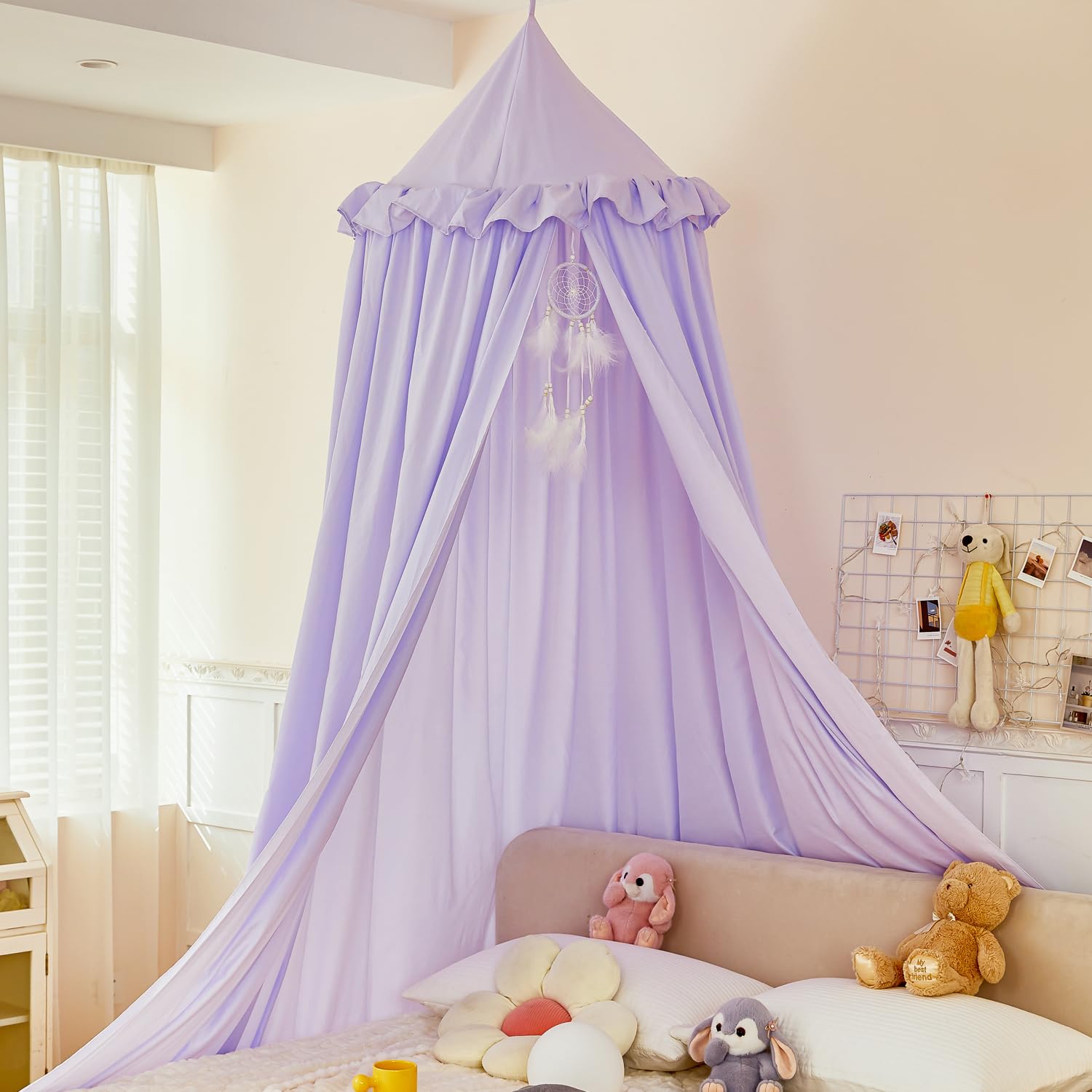 Purple canopy over kid's bed showcasing princess decor