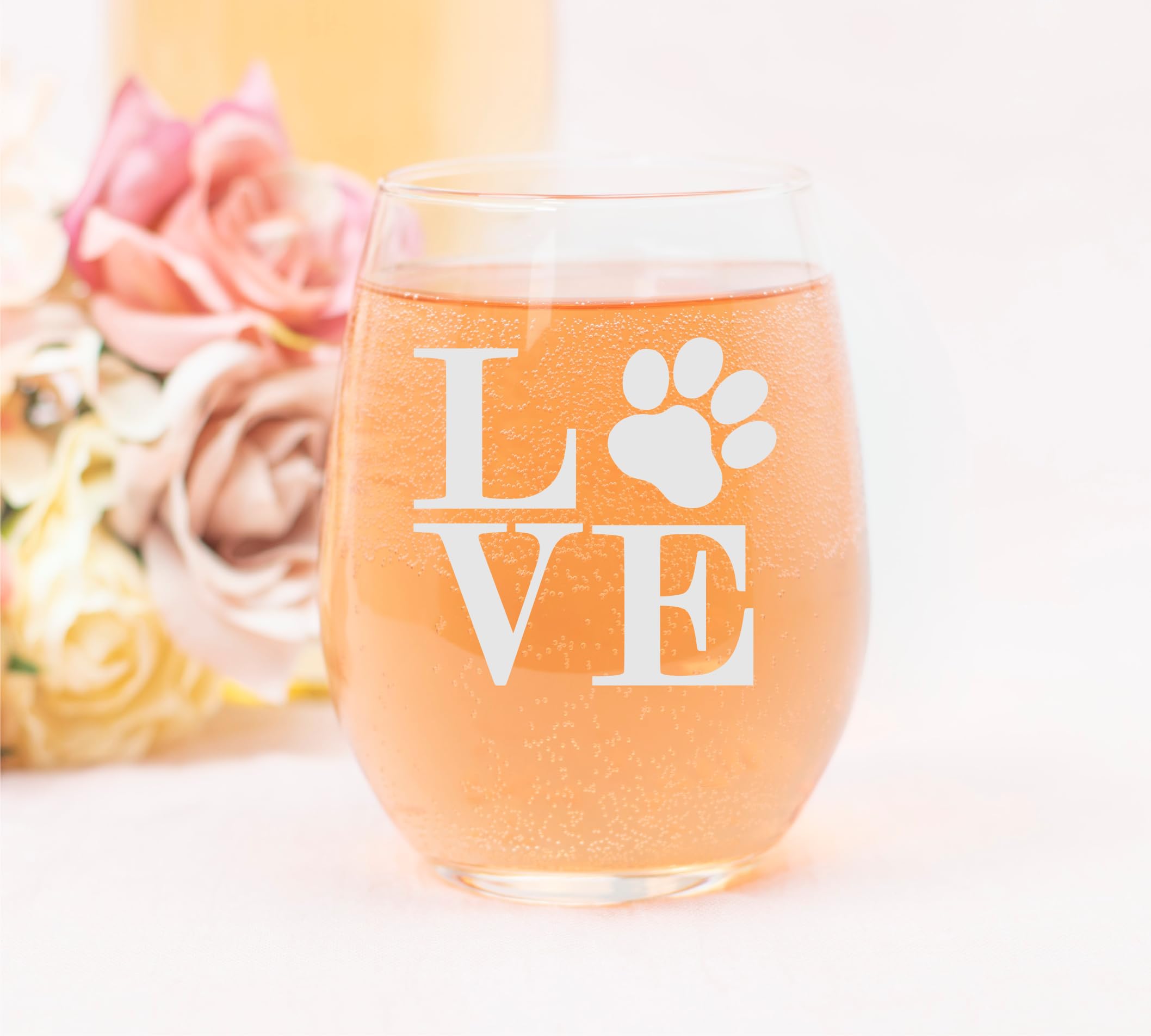 Paw print love design stemless wine glass 17 oz on table